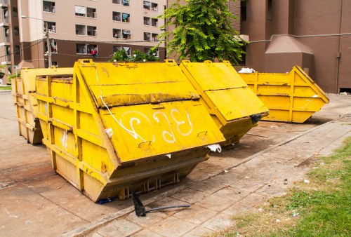 Waste removal crew collecting large items from a local home