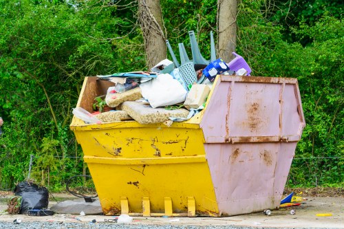 Local junk clearance team removing bulky household waste from a residential property