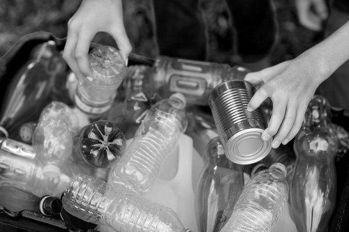 Rubbish clearance team loading household waste into a vehicle