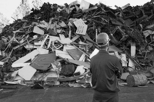 Garage clearance team removing bulky household waste from a local property garage