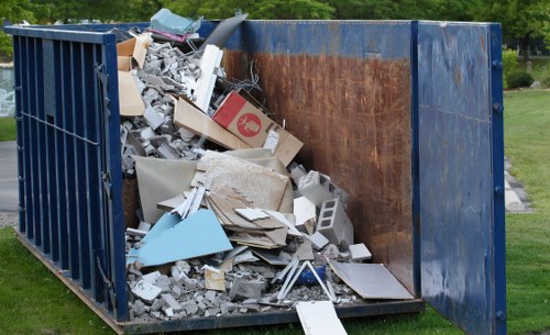 Mixed household furniture prepared for waste removal in a residential property
