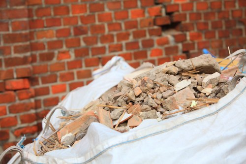 Waste clearance team loading bulky household waste from a residential property
