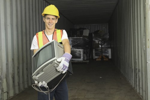 Council waste collection service helping a homeowner clear bulky unwanted items