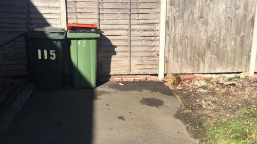 Neatly sorted garage items ready for waste removal and loading