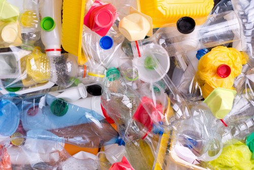 Waste removal crew clearing furniture and household rubbish from a flat